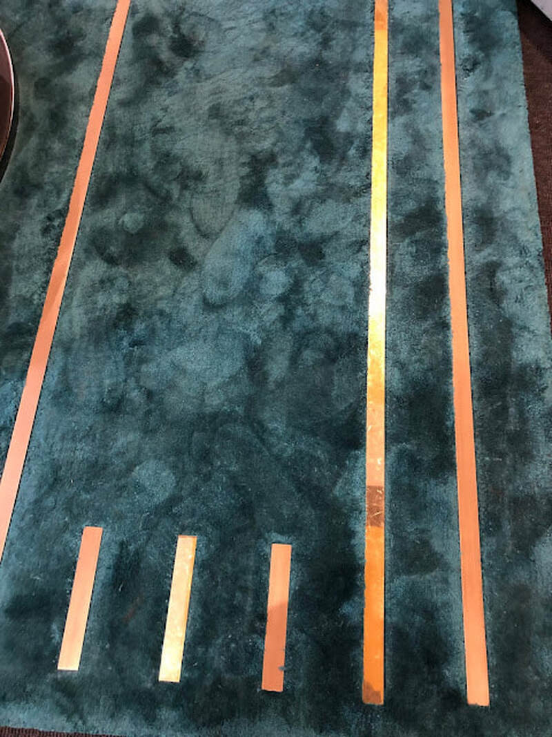 Metallic accent on hand-knotted rugs seen in Milano