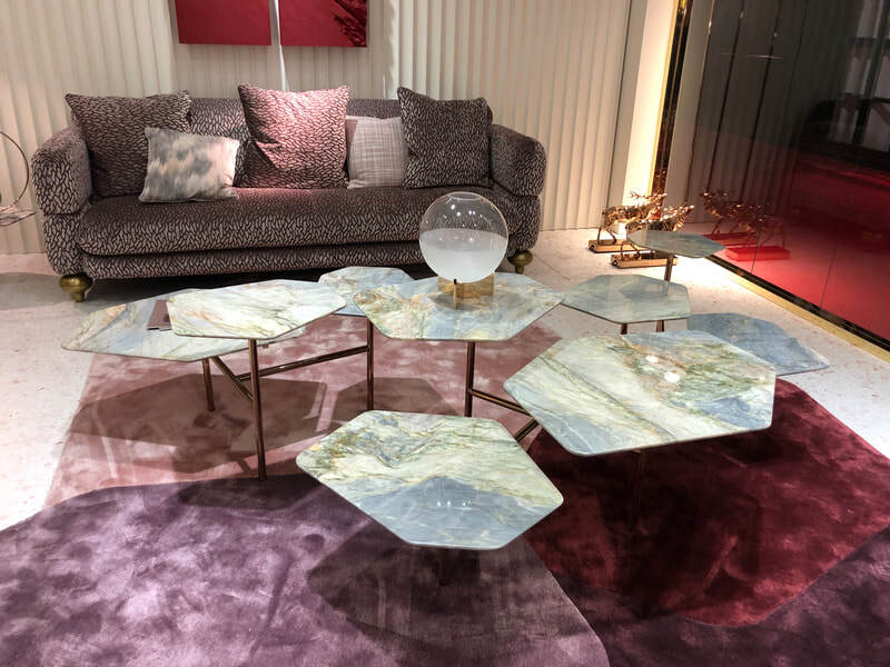 The synergy between Clan Milano's green marble cluster coffee tables and the rugs was perfection